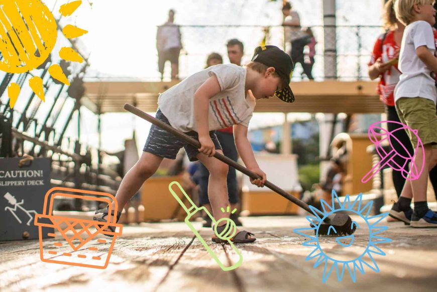 A kid swabbing the deck of a ship
